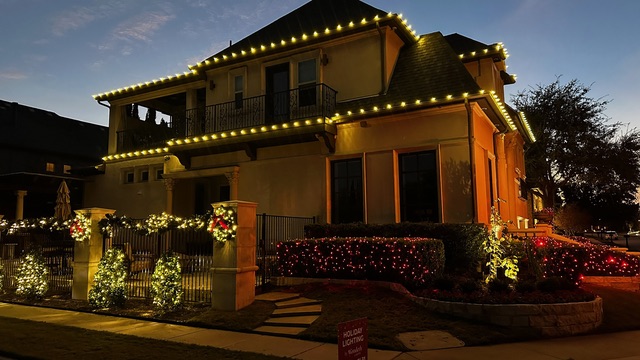 Lit wreath and garland on the entry